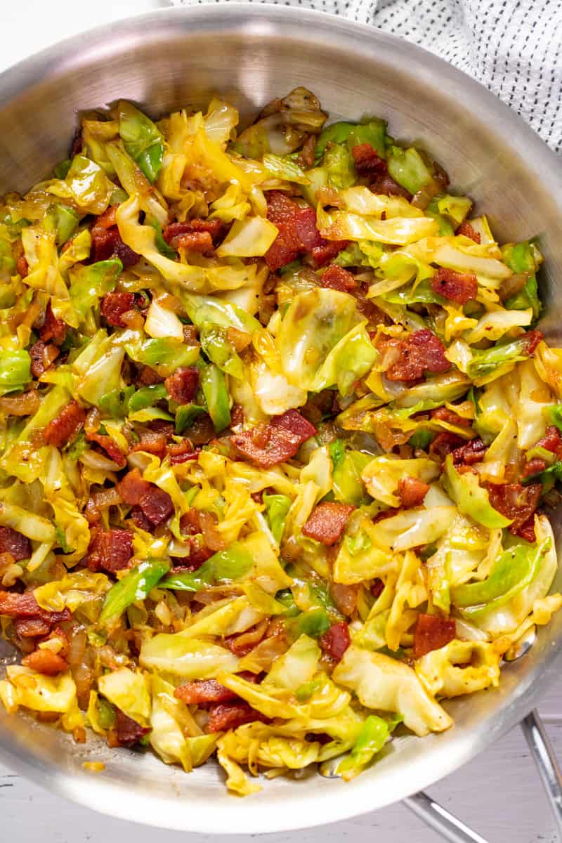Fried Cabbage in a stainless steel pan.