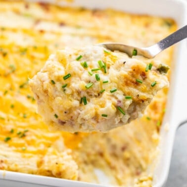 Twice baked potato casserole on a spoon.